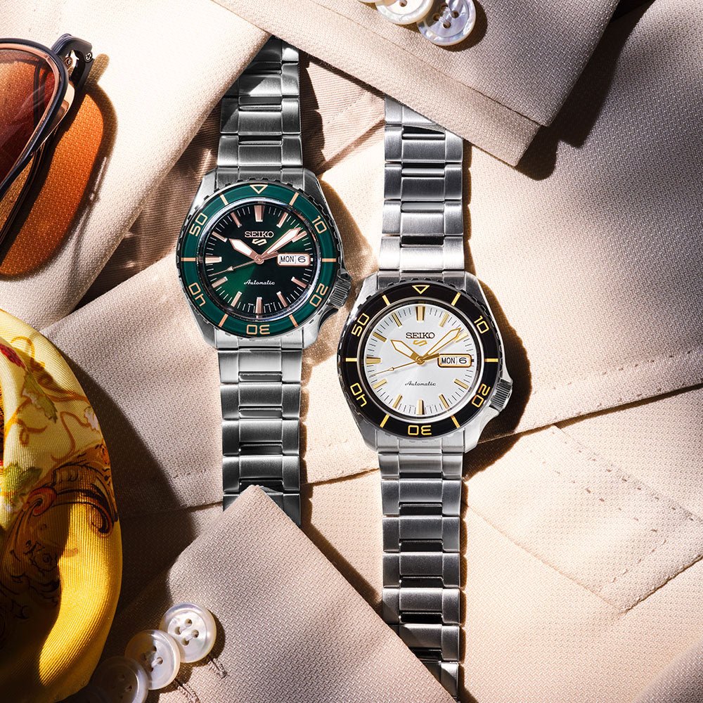 Seiko 5 Sports HDB004 front view with white sunburst dial, black bezel and gold-coloured hands