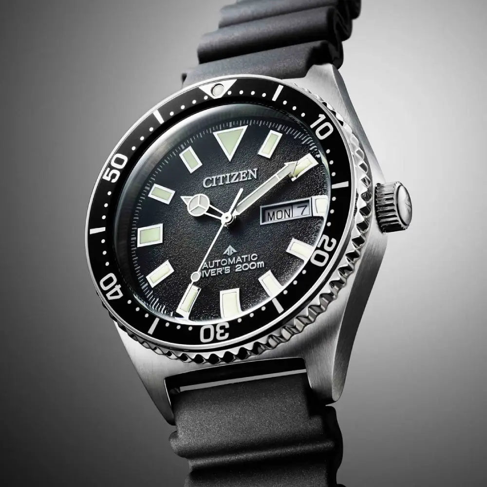 Citizen Promaster NY0120-01E black dial and luminous markers close-up